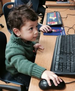 Wealthy Affiliate does it work - Image of a little boy working on a PC