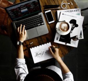 How To Fix Writer's Block- A man at his Laptop being distracted from his work_Image 5 of your Post