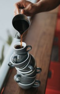 What Is Work Life Integration-A picture of a bunch of coffee cups stacked up trying to be balanced while pouring coffee into the top one at the same time -Image 2 for blog post.