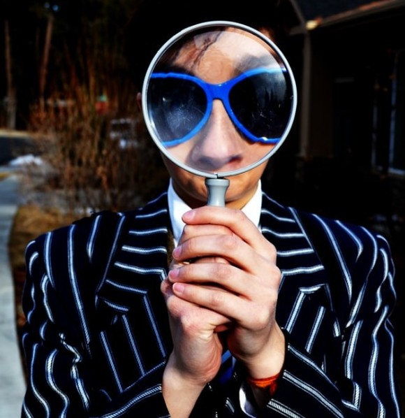 How To Overcome The Fear Of Failure And Start A Blog - image 1 for article an man with glasses looking through a magnifying glass